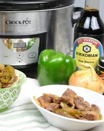 Crock Pot Pepper Steak is a flavorful Chinese food favorite combining strips of steak, bell peppers, onions, garlic, and with traditional Chinese flavors. #ChineseFood #Steak #PepperSteak #BeefRecipes #CrockPotRecipes