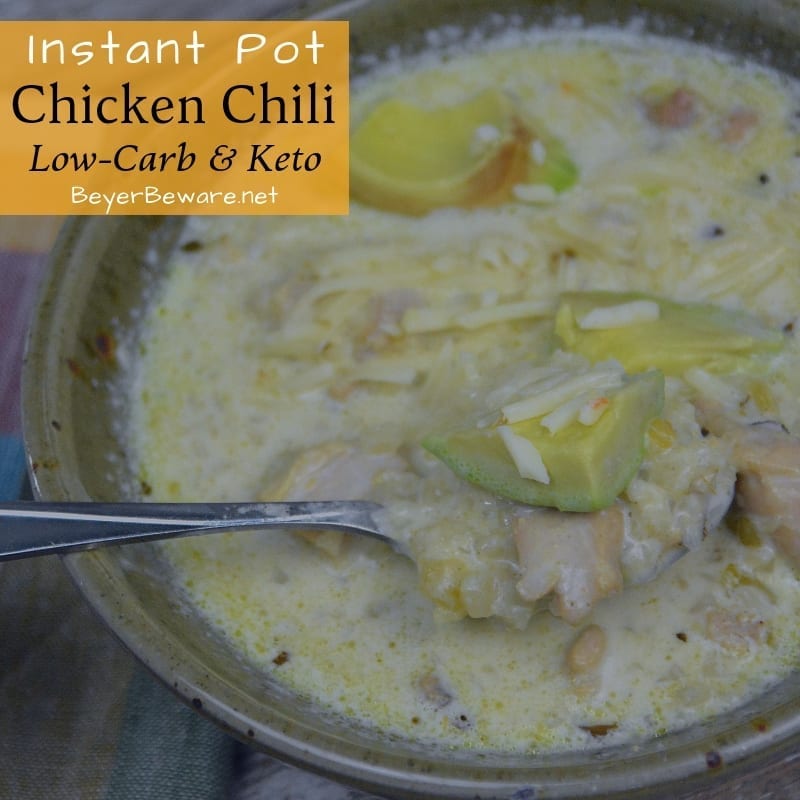 Low-Carb Instant Pot Chicken Chili is low on carbs but high in fat and flavor with tender pieces of chicken given rich flavors from better than bouillion, garlic and onions, and lots of adobo seasoning. Plus with riced cauliflower, you don't even miss the beans either. #Keto #KetoSoup #LowCarb #LowcarbSoup #ChickenChili