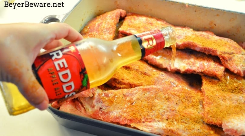 Hard cider oven-baked BBQ ribs are an easy combination of dry rub, hard cider, and barbecue sauce where the flavors meld together after hours of slow roasting. #ribs #Spareribs #BBQ