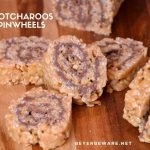 These scotcharoos pinwheels combine the crispy rice cereal, peanut butter, sugar, and corn syrup for the base and then topped and rolled with melted butterscotch and chocolate. #PeanutButter #Chocolate #Nobake #DessertRecipes #BarRecipes