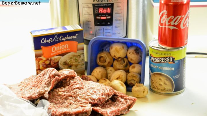 Instant Pot Coca-Cola Cubed Beef Steaks is a simple recipe made quickly with the dump of cubed steaks, a Coke, onion soup mix and cream of mushroom soup in the Instant Pot.