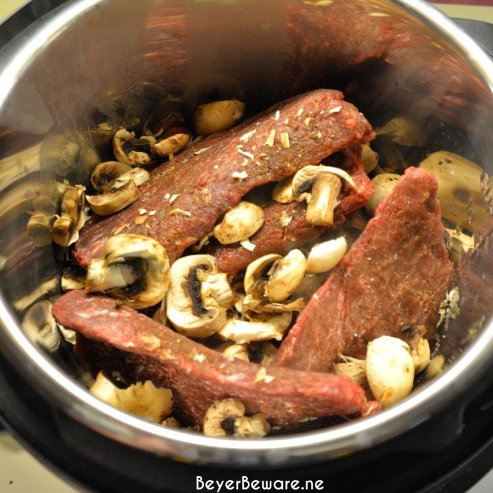 Instant Pot Coca-Cola Cubed Beef Steaks is a simple recipe made quickly with the dump of cubed steaks, a Coke, onion soup mix and cream of mushroom soup in the Instant Pot.