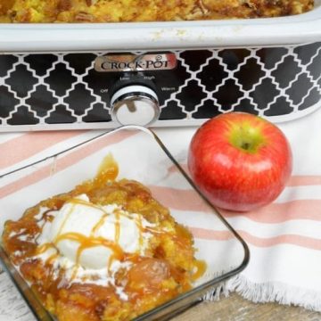 Crock Pot Apple Pie Dump Cake recipe is just a few simple ingredients of apple pie filling, cake mix, butter and pecans and in the crock pot for a couple hours. #CrockPot #Apple #DumpCake
