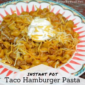 Instant Pot Taco Hamburger Pasta is the 15-minute homemade Hamburger Helper with just five ingredients creating a taco flavored cheesy taco beef and shells. #InstantPot #Hamburger #HamburgerHelper #Beef #EasyDinners