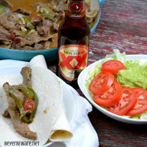 Beer braised steak fajitas are a quick skillet beef fajita recipe thanks to some fajita meet and tenderizing from the beer. #Fajitas #Steak #QuickMeals