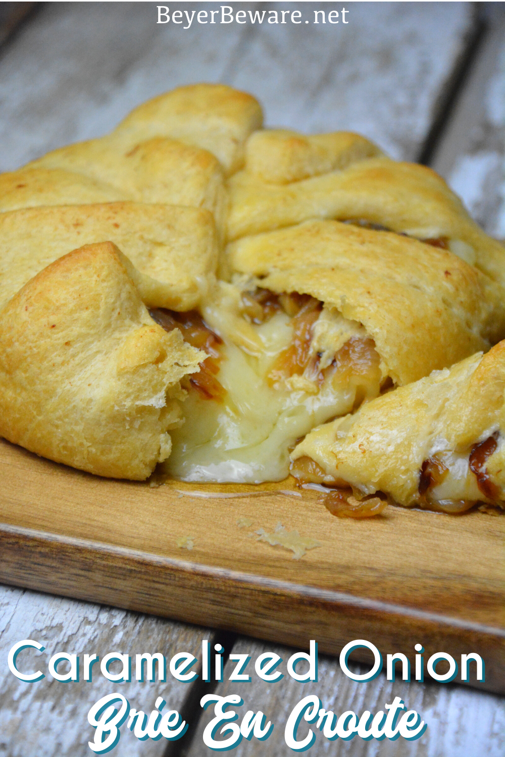 Caramelized onion baked brie crescent round is a simple brie en croute recipe made with caramelized onions and brie for a baked brie recipe.