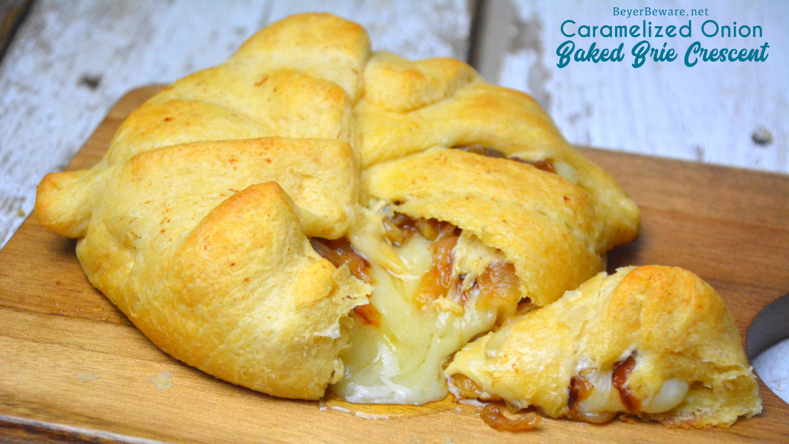 Caramelized onion baked brie crescent round is a simple brie en croute recipe made with caramelized onions and brie for a baked brie recipe.