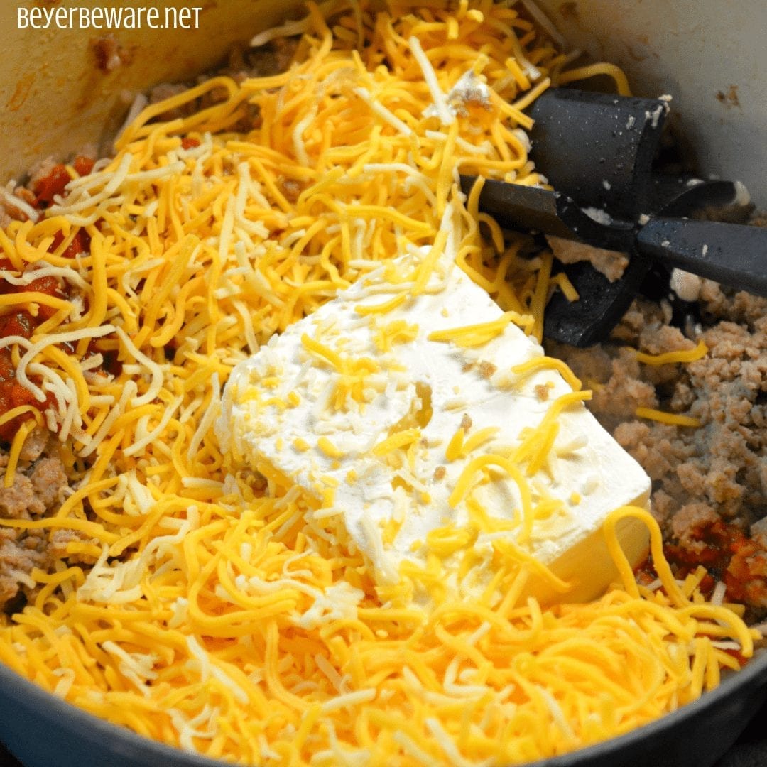 Low-Carb Taco Stuffed Peppers have a queso sausage filling that is full of your favorite Mexican flavors and baked to form a cheesy crust over the peppers and sausage filling. #Keto #Lowcarb #StuffedPeppers #Sausage #Queso #GlutenFree