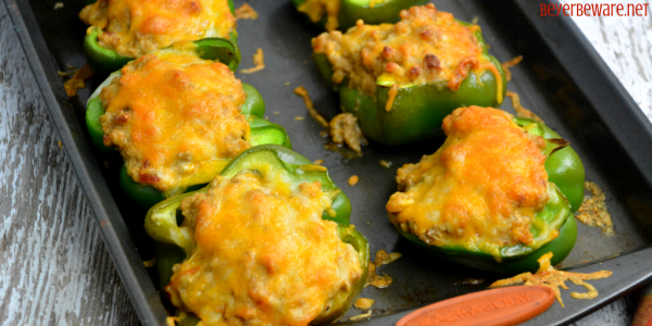 Low-Carb Taco Stuffed Peppers have a queso sausage filling that is full of your favorite Mexican flavors and baked to form a cheesy crust over the peppers and sausage filling. #Keto #Lowcarb #StuffedPeppers #Sausage #Queso #GlutenFree