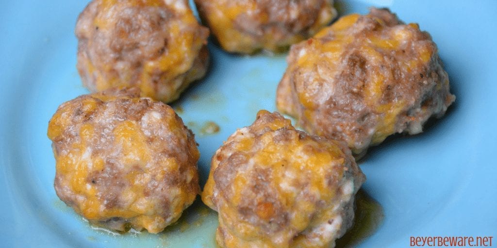 Low-Carb sausage balls use ground pork, cream cheese, parmesan and shredded cheeses to form the base for an oven baked pork meatball. #keto #lowcarb #meatballs #sausage