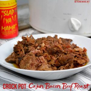 Crock Pot Cajun Bacon Beef Roast is full of Cajun flavors and smokiness from the bacon and bacon grease with tenderness brought on from a can of Coke. #PotRoast #CrockPot #Bacon #CajunRecipes #Beef