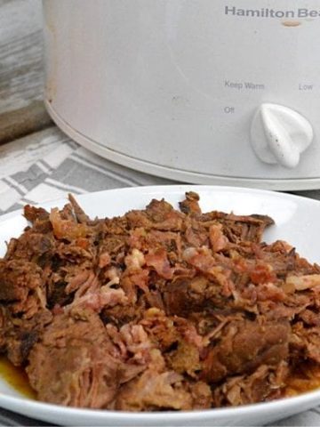 Crock Pot Cajun Bacon Beef Roast is full of Cajun flavors and smokiness from the bacon and bacon grease with tenderness brought on from a can of Coke. #PotRoast #CrockPot #Bacon #CajunRecipes #Beef