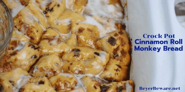 Crock Pot Cinnamon Roll Monkey Bread combines two tubes of refrigerator cinnamon rolls with caramel sauce that becomes a gooey cinnamon pull-apart bread that is drowned in icing to finish it off.  #crockpot #MonkeyBread #CinnamonRolls #Breakfast