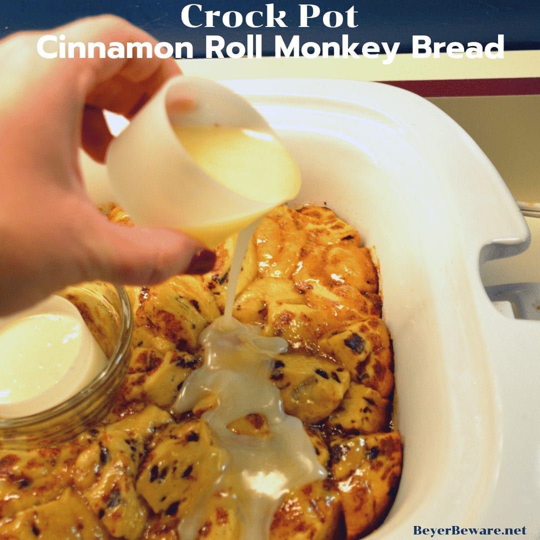 Crock Pot Cinnamon Roll Monkey Bread combines two tubes of refrigerator cinnamon rolls with caramel sauce that becomes a gooey cinnamon pull-apart bread that is drowned in icing to finish it off.  #crockpot #MonkeyBread #CinnamonRolls #Breakfast