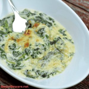 Keto Creamed Spinach is a simple gluten free creamed spinach recipe combining steamed spinach, butter, heavy whipping cream, and mozzarella and parmesan cheeses. #GlutenFree #LowCarb #Keto #SideDishes #Recipes #Keto #Spinach #Cheese