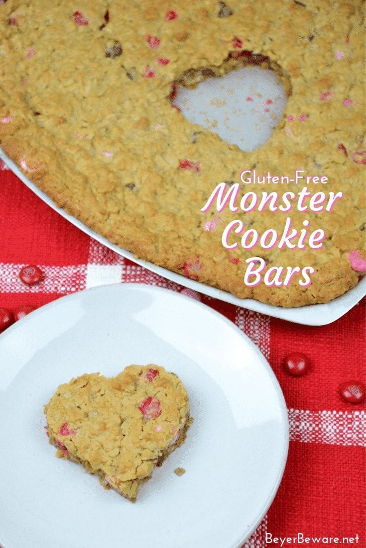 Gluten-Free Monster Cookie bars are a flourless bar cookie recipe combining peanut butter, oats, chocolate chips, and M & Ms to create a chewy chocolate cookie treat. #GlutenFree #Peanutbutter #Chocolate #GlutenFreeDessert #BarCookies
