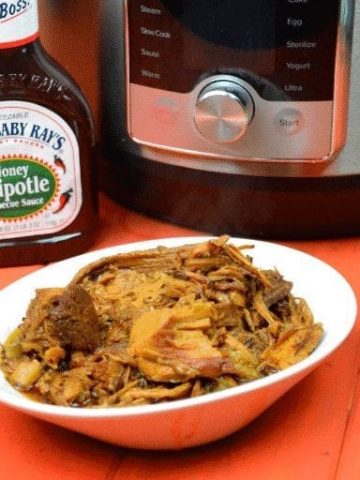 Instant Pot Zesty BBQ Pulled Pork makes a pork shoulder a flavorful and juicing bbq pulled pork with the help of root beer and zesty Italian dressing in 90 minutes. #PulledPork #BBQ #BBQPork #InstantPot #Pork #BBQPork