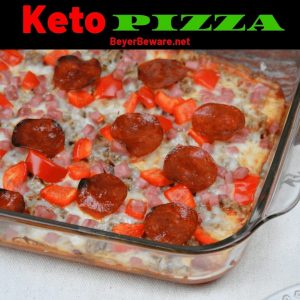 Keto pizza made with a cream cheese crust and topped with a thin layer of tomato sauce, your favorite toppings, and cheese. #Keto #LowCarb #Pizza #KetoPizza #LowCarbCrust