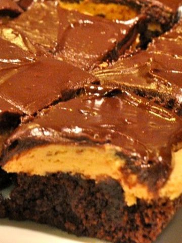Buckeye brownies are a basic boxed brownie mix topped off with a smooth and creamy peanut butter frosting and chocolate ganache.