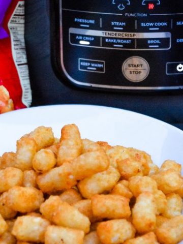 Ninja Foodi Air Fryer Tater Tots are the best made at home tater tots. So simple and ready in under 15 minutes. For extra crunch, make mini tater tots for the ultimate crispy to soft inside combination.