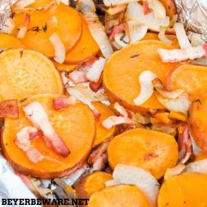 Grilled Sweet Potatoes with Bacon and Onions are an easy grilled side dish recipe perfect for your next BBQ. #BBQ #SideDish #Recipes #SweetPotatoes #Bacon