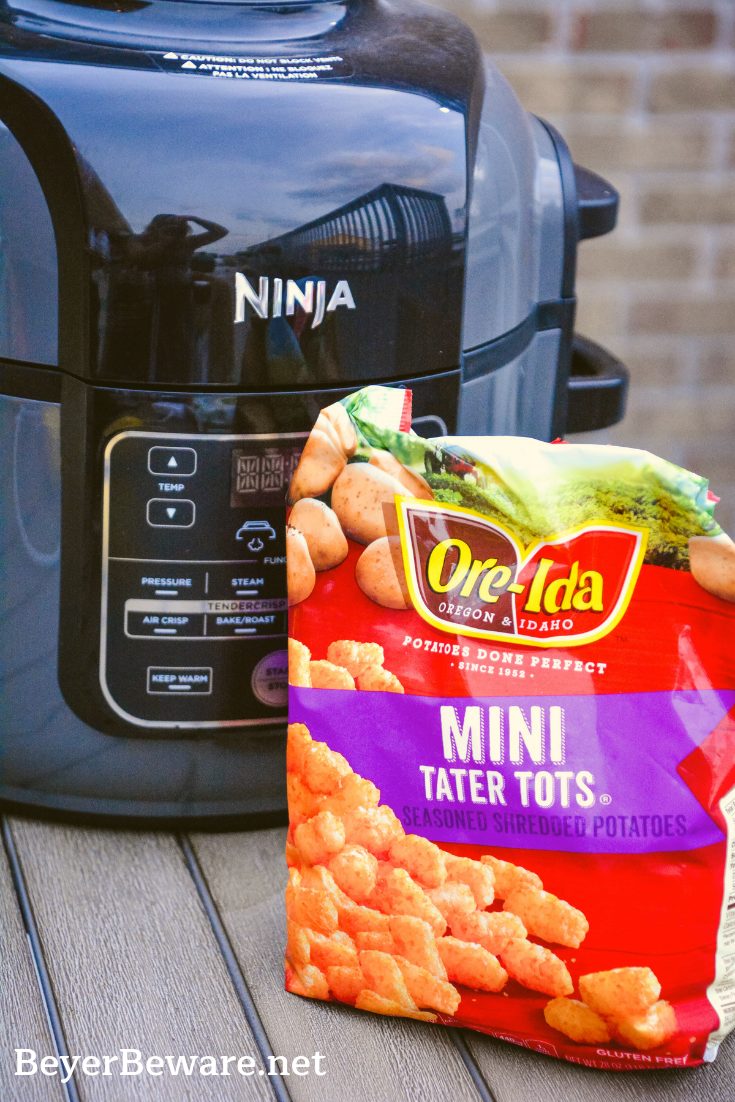 Ninja Foodi Air Fryer Tater Tots are the best made at home tater tots. So simple and ready in under 15 minutes. For extra crunch, make mini tater tots for the ultimate crispy to soft inside combination. #AirFryer #NinjaFoodi #TaterTots