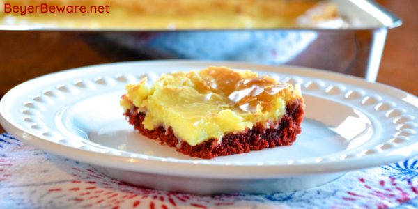 Red Velvet Ooey Gooey Butter Bars are a simple cake mix brownie baked with a cream cheese topping for your new favorite red velvet and cream cheese dessert. #RedVelvet #CakeMix #Dessert #Chocolate #Recipes