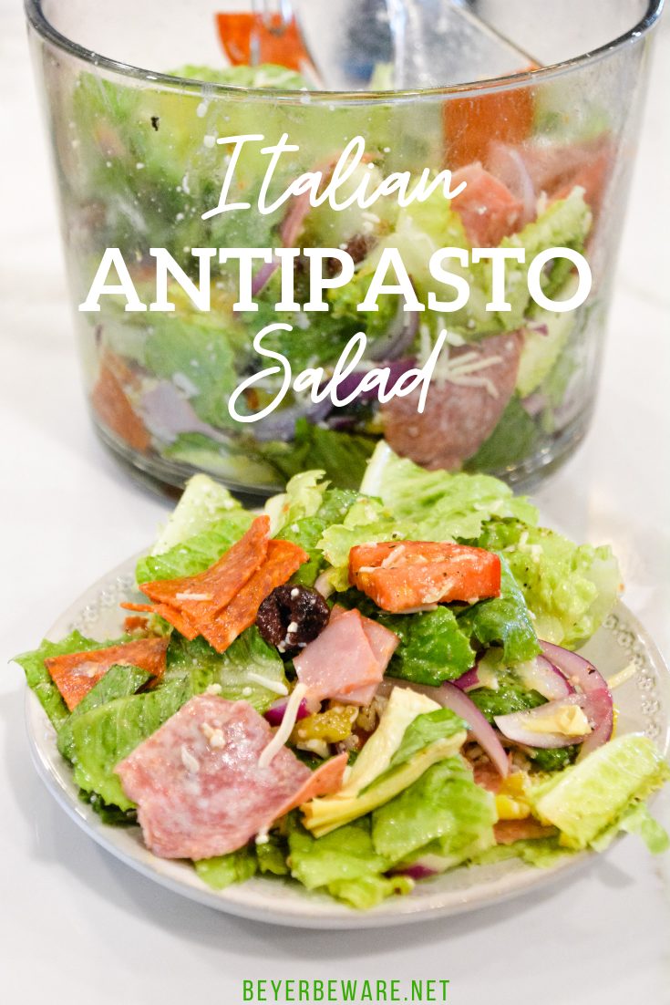 Italian antipasto salad is a hearty dinner salad with a romaine lettuce base and filled up with salami, pepperoni, tomatoes, cucumbers, onions, olives, banana peppers, and cheese dressed with a homemade Italian dressing.