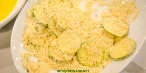 Low-Carb Air Fryer Zucchini Chips are made with sliced zucchini, almond flour, parmesan cheese, steak seasoning and eggs and ready in 10 minutes in the Ninja Foodi or air fryer.