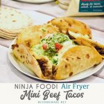 Air Fryer Mini Beef Tacos in the Ninja Foodi is an easy fried taco recipe made with taco seasoned hamburger, cheese and flour or corn tortilla shells.