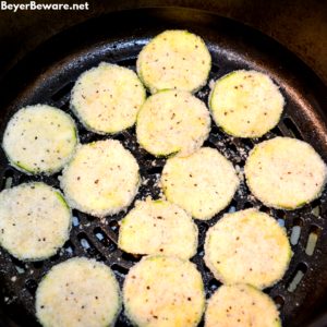 Low-Carb Air Fryer Zucchini Chips are made with sliced zucchini, almond flour, parmesan cheese, steak seasoning and eggs and ready in 10 minutes in the Ninja Foodi or air fryer.