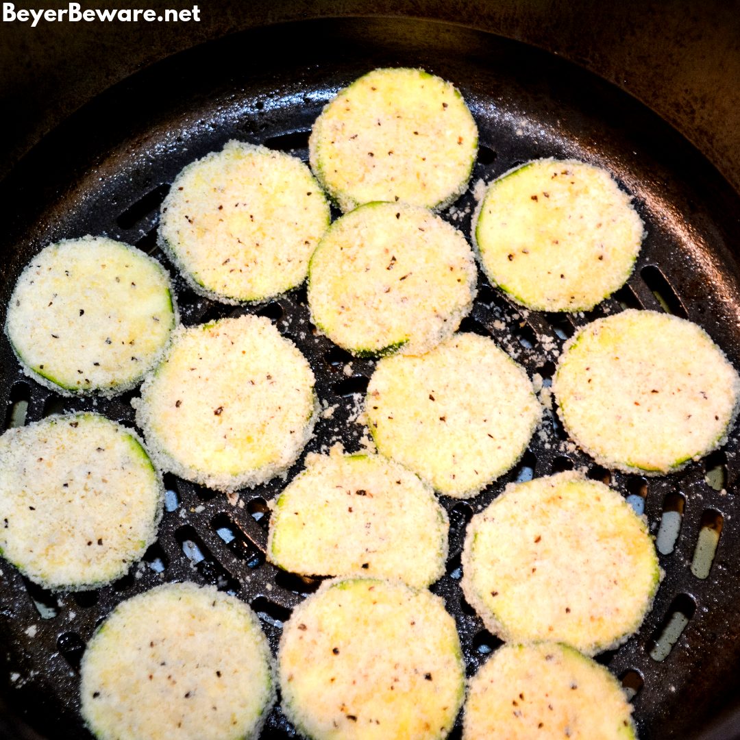 Low-Carb Air Fryer Zucchini Chips are made with sliced zucchini, almond flour, parmesan cheese, steak seasoning and eggs and ready in 10 minutes in the Ninja Foodi or air fryer.