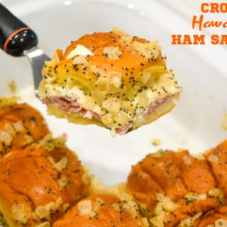 Crock pot Hawaiian roll ham sandwiches are the warm buttery mustard ham sandwich recipe made with onions, poppy seeds, and Swiss cheese without needing to bake them with the same results.