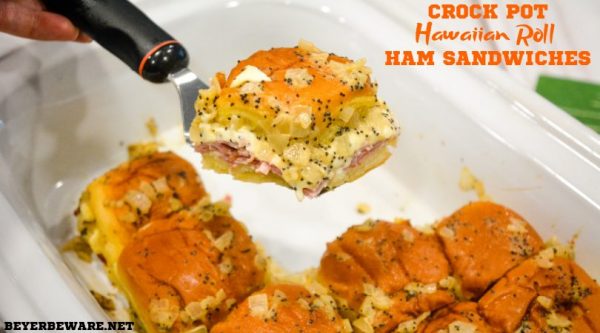 Crock pot Hawaiian roll ham sandwiches are the warm buttery mustard ham sandwich recipe made with onions, poppy seeds, and Swiss cheese without needing to bake them with the same results.