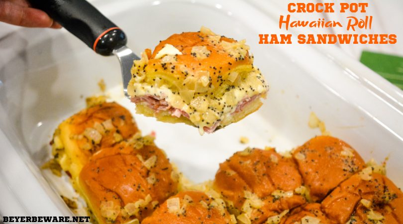 Crock pot Hawaiian roll ham sandwiches are the warm buttery mustard ham sandwich recipe made with onions, poppy seeds, and Swiss cheese without needing to bake them with the same results.