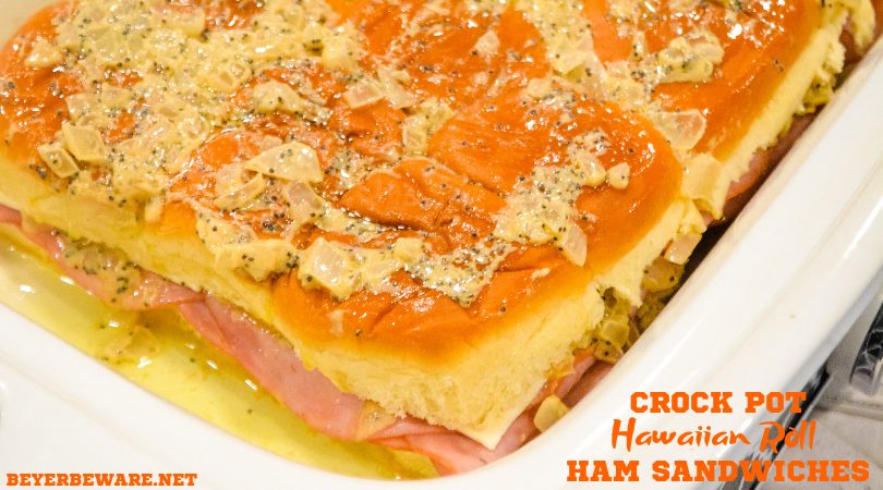 Crock pot Hawaiian roll ham sandwiches are the warm buttery mustard ham sandwich recipe made with onions, poppy seeds, and Swiss cheese without needing to bake them with the same results.