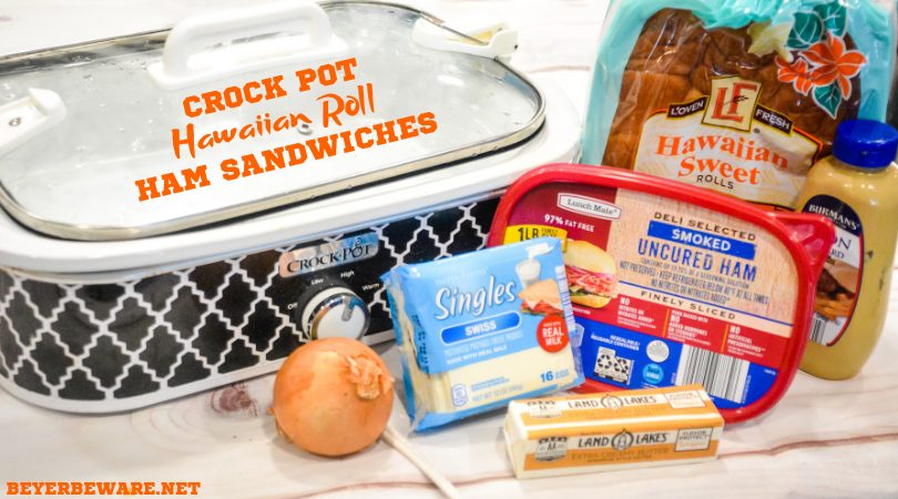 Crock pot Hawaiian roll ham sandwiches are the warm buttery mustard ham sandwich recipe made with onions, poppy seeds, and Swiss cheese without needing to bake them with the same results.