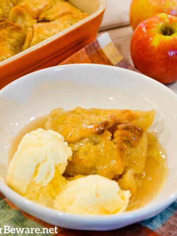 Super Easy 5-Ingredient Apple Dumplings are made with store-bought pie crusts, apples, cinnamon and sugar, butter, and a simple cinnamon and sugar syrup.