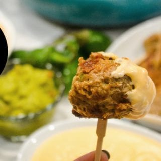 Low-Carb Jalapeno Popper Meatballs combine hamburger with chopped jalapenos, cream cheese, cheddar cheese, and lots of seasoning for the perfect gameday appetizer or quick dinner recipe.