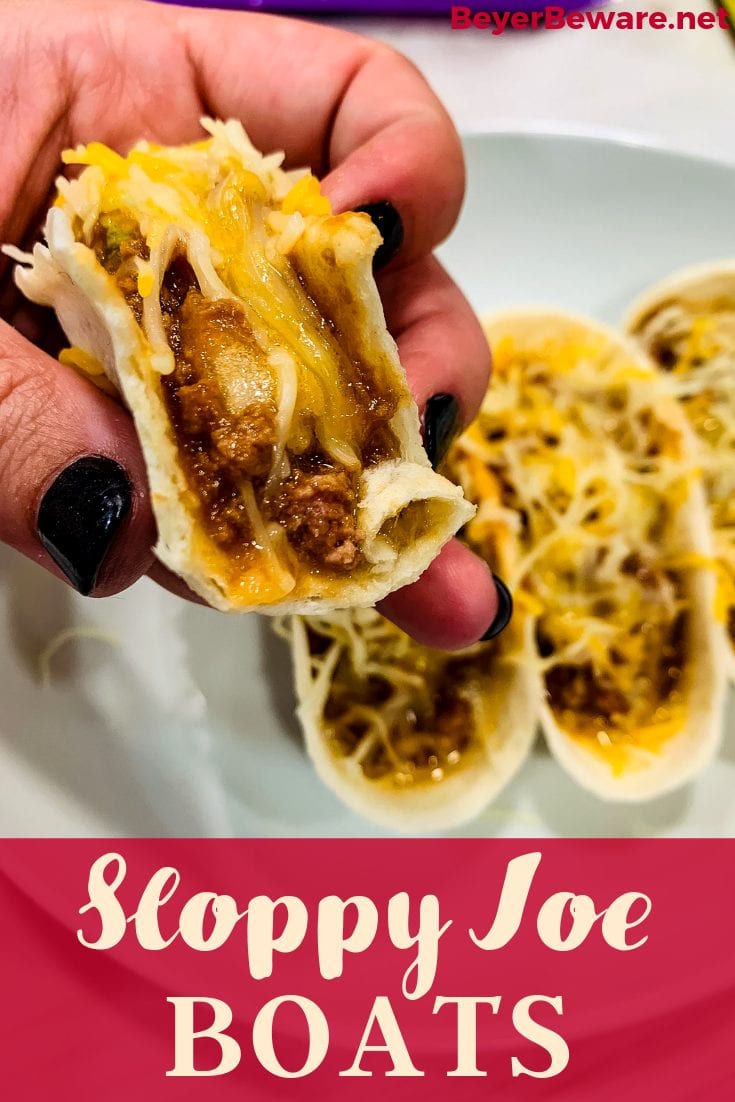 Sloppy Joe Boats is the easy way to eat your sloppy joe recipe without the mess by fill taco boat shells with sloppy joe and topping off with cheese. 