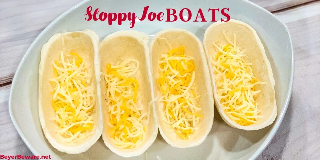 Sloppy Joe Boats is the easy way to eat your sloppy joe recipe without the mess by fill taco boat shells with sloppy joe and topping off with cheese. 