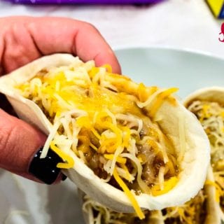 Sloppy Joe Boats is the easy way to eat your sloppy joe recipe without the mess by fill taco boat shells with sloppy joe and topping off with cheese. 