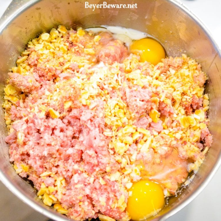 Start by crushing the crackers. Place the ground pork and ham in a large bowl. Pour the crushed