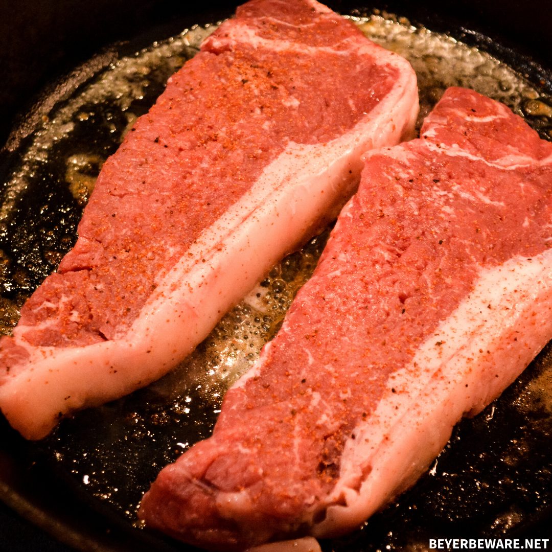 Skillet strip steaks with cajun compound butter create a steakhouse experience with a simple compound butter and making New York strips steaks on the stove in your cast iron skillet.