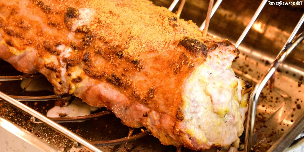 Cordon bleu pork loin recipe is stuffed full of ham and swiss cheese rolled up in a creamy mustard sauce and encrusted in a parmesan crust. 