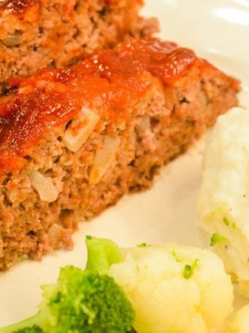 Mom's best meatloaf recipe is a gluten-free recipe as it is made with ground beef, oats, onions, eggs, milk, and a sweet and tangy glaze that is baked to perfection.