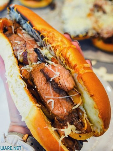 Leftover steak sandwiches uses up cooked steaks to create a midwest version of a Philly Cheesesteak sandwich with caramelized mushrooms, onions and peppers.