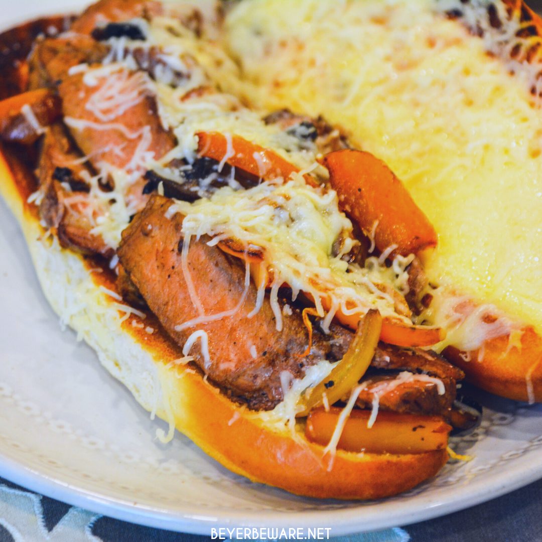 Leftover steak sandwiches uses up cooked steaks to create a midwest version of a Philly Cheesesteak sandwich with caramelized mushrooms, onions and peppers.