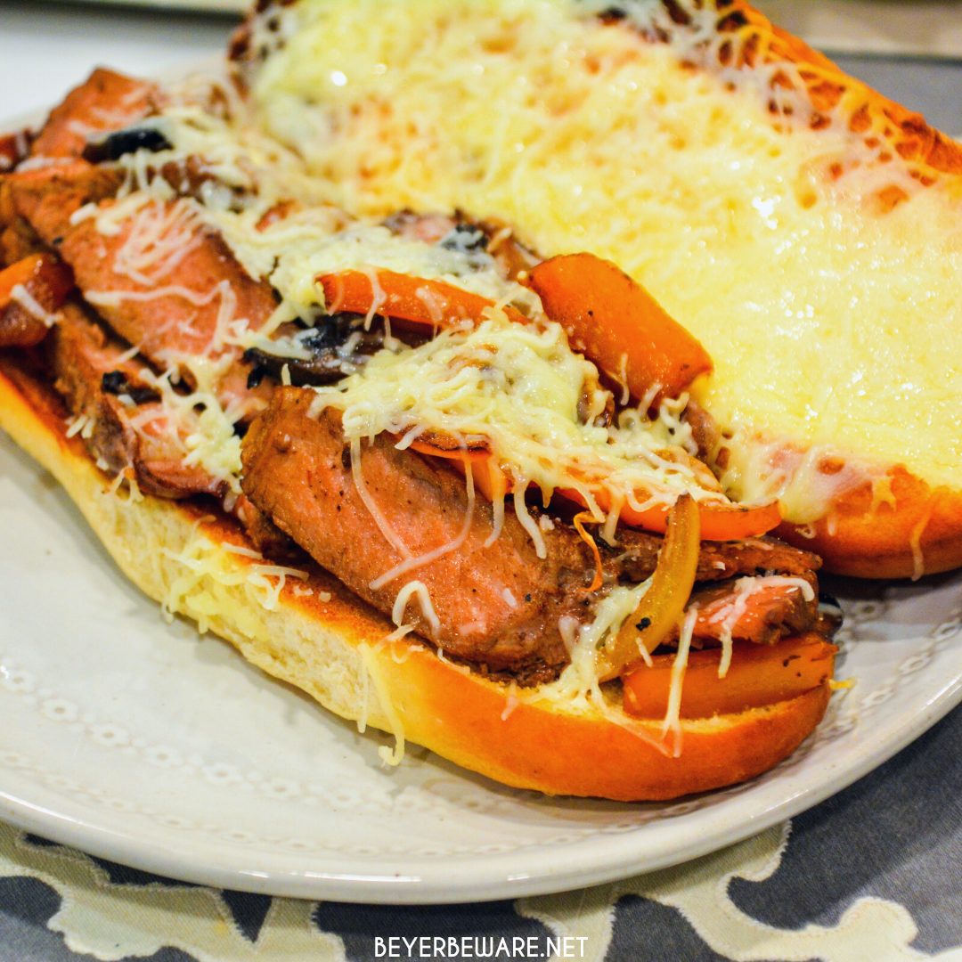 Leftover steak sandwiches uses up cooked steaks to create a midwest version of a Philly Cheesesteak sandwich with caramelized onions and peppers.