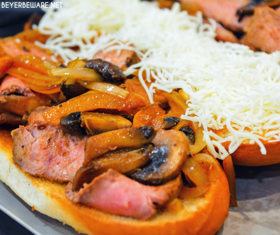 Leftover steak sandwiches uses up cooked steaks to create a midwest version of a Philly Cheesesteak sandwich with caramelized mushrooms, onions and peppers.